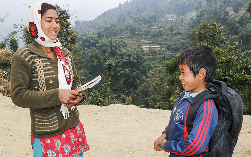 Renuka and Milan face each other outside of the summer camp in the Himalayan foothills.