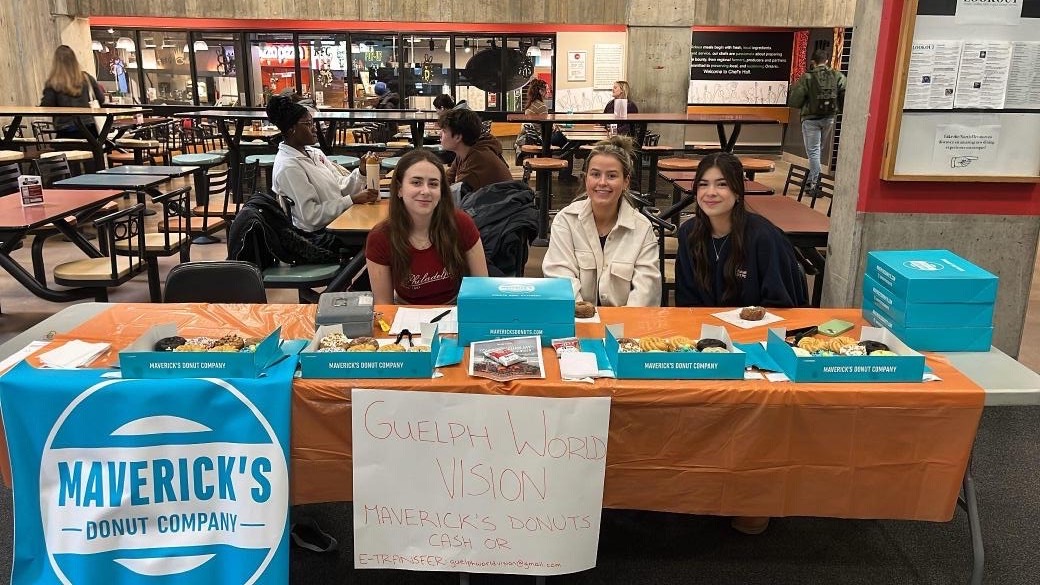 WVC campus club leaders from Guelph at a fundraiser selling donuts.