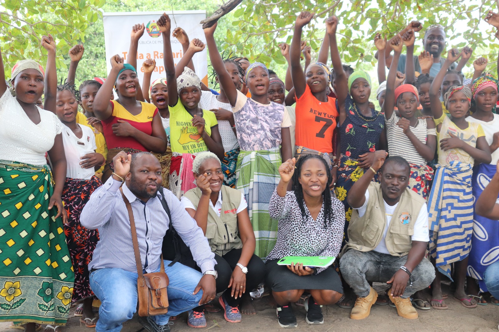 A group of people cheer.