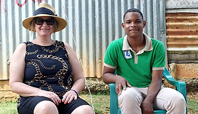 A woman and man sitting in a chair. Sponsor: Judith