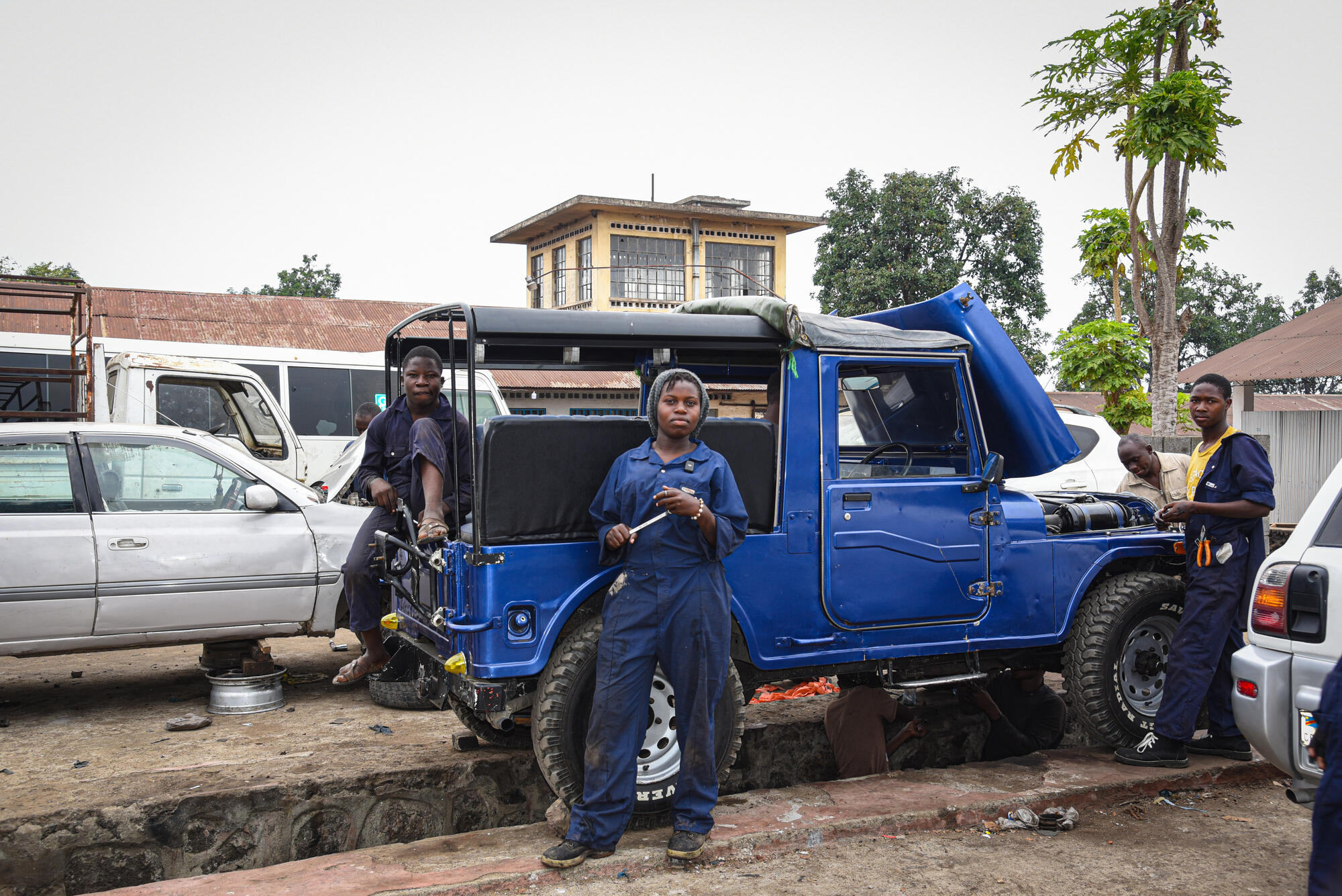 Immaculée standing out as a female mechanic